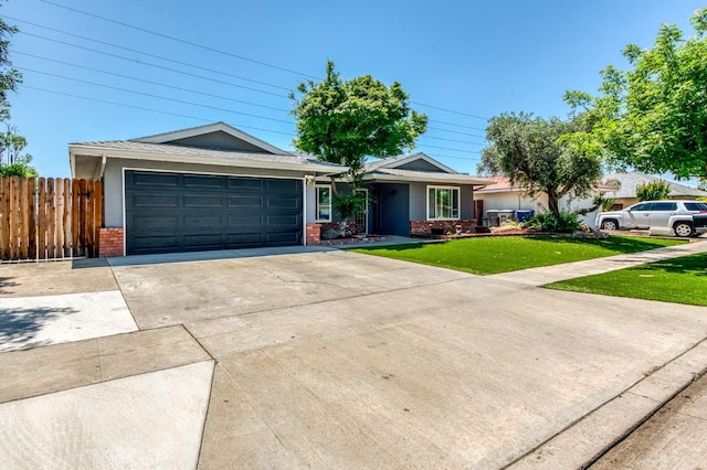 5932 E Illinois Ave, Fresno, CA 93727 - ranch-style home with brick siding, concrete driveway, an attached garage, and stucco siding