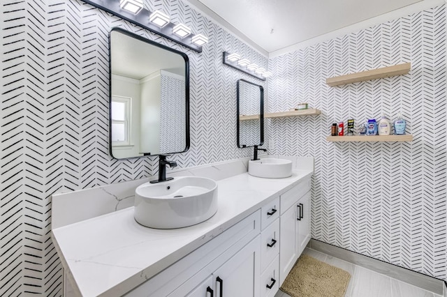 5932 E Illinois Ave, Fresno, CA 93727 - bathroom featuring crown molding, double vanity, tile patterned flooring, and tile walls