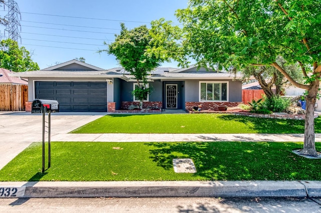 5932 E Illinois Ave, Fresno, CA 93727 - single story home with brick siding, concrete driveway, an attached garage, and stucco siding