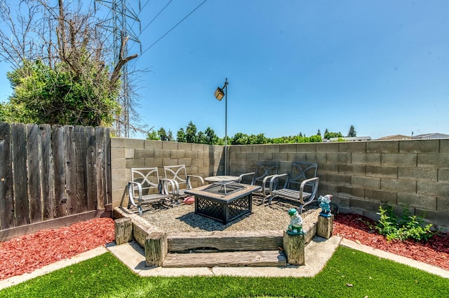 5932 E Illinois Ave, Fresno, CA 93727 - view of yard with a fire pit and fence