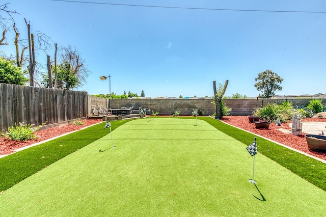 5932 E Illinois Ave, Fresno, CA 93727 - fenced backyard featuring an area to practice putting