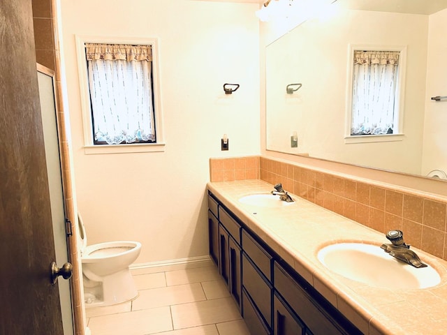full bathroom with tile patterned flooring, decorative backsplash, toilet, double vanity, and an enclosed shower