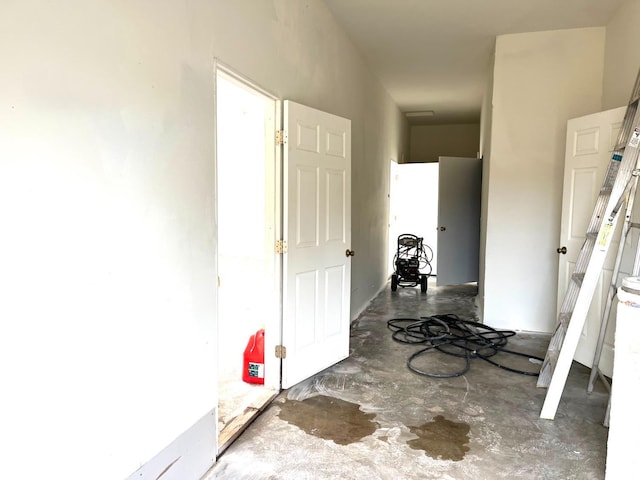 hall featuring concrete floors