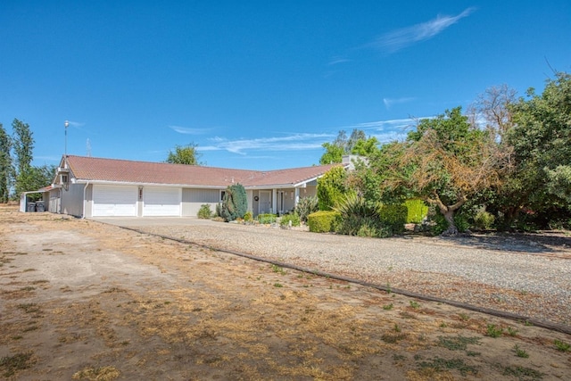 view of front of house featuring an attached garage and driveway