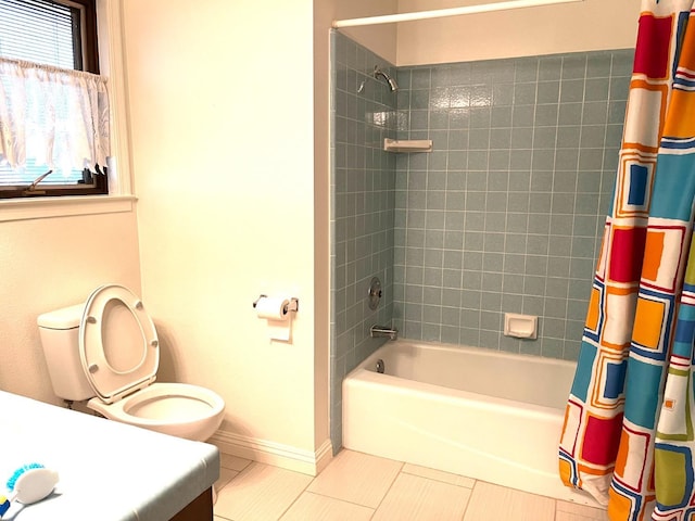 full bathroom with shower / bathtub combination with curtain, toilet, tile patterned flooring, baseboards, and vanity