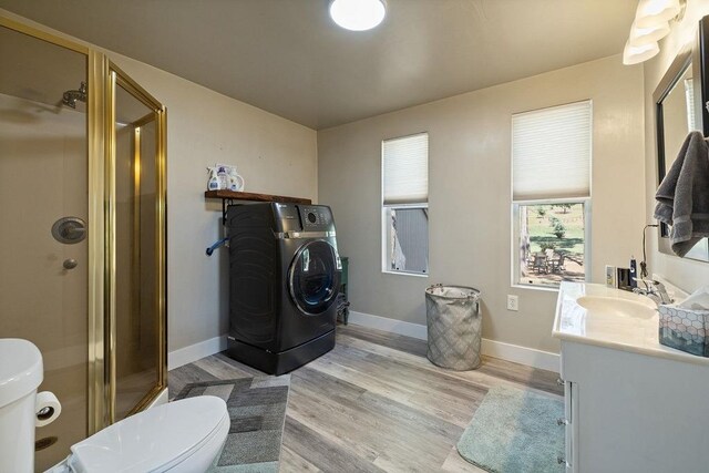 42640 Pinecone Ln, Auberry, CA 93602 - full bathroom with washer / clothes dryer, toilet, vanity, wood finished floors, and a stall shower