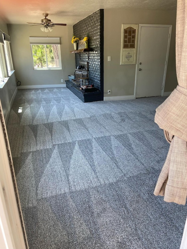 42640 Pinecone Ln, Auberry, CA 93602 - unfurnished living room featuring a ceiling fan, carpet flooring, and baseboards