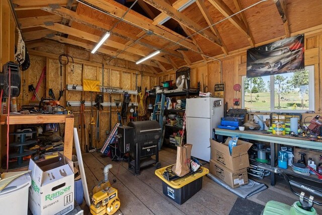42640 Pinecone Ln, Auberry, CA 93602 - garage with a workshop area and freestanding refrigerator