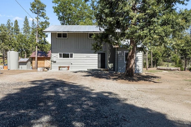 42640 Pinecone Ln, Auberry, CA 93602 - view of front facade with driveway and board and batten siding