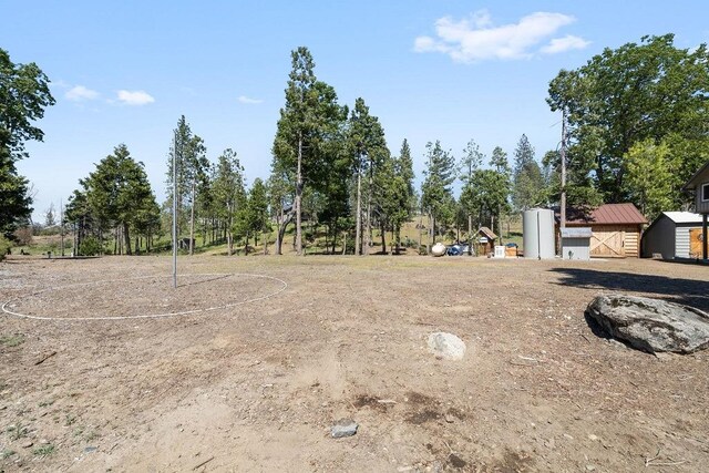 42640 Pinecone Ln, Auberry, CA 93602 - view of yard featuring view of wooded area