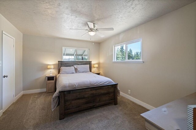 42640 Pinecone Ln, Auberry, CA 93602 - carpeted bedroom with a textured ceiling, baseboards, and a ceiling fan
