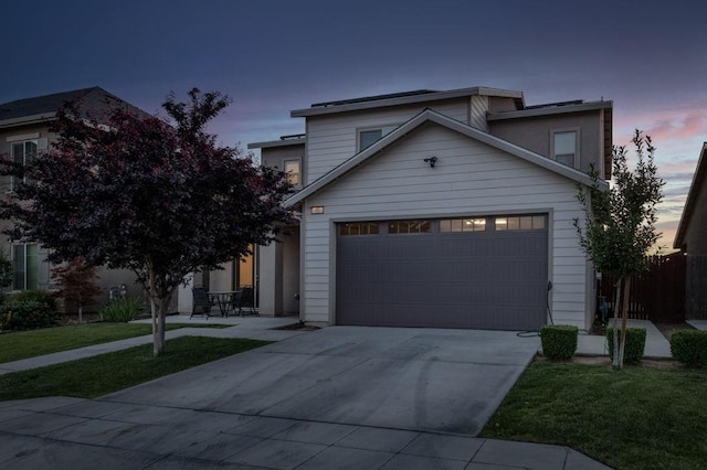 99 N Whittier Ave, Fresno, CA 93727 - view of front of house featuring concrete driveway, an attached garage, and a front yard