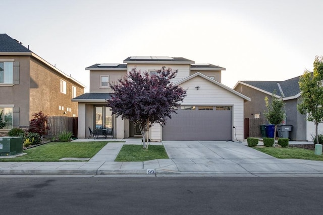 99 N Whittier Ave, Fresno, CA 93727 - traditional-style house featuring roof mounted solar panels, concrete driveway, and an attached garage