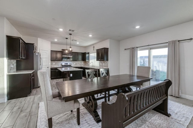 99 N Whittier Ave, Fresno, CA 93727 - dining space with recessed lighting, plenty of natural light, light wood-style flooring, and baseboards
