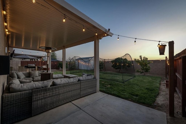99 N Whittier Ave, Fresno, CA 93727 - patio terrace at dusk with an outdoor living space and area for grilling