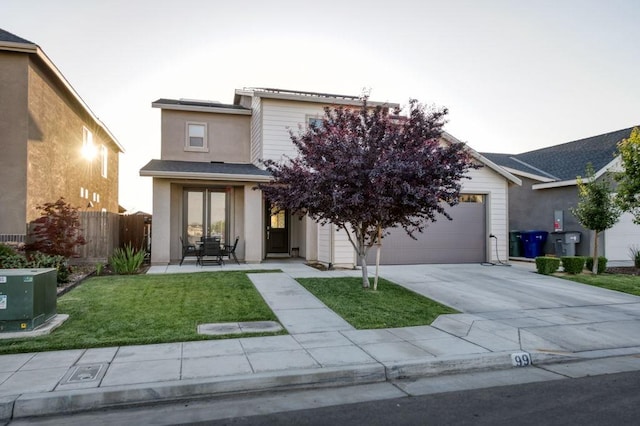99 N Whittier Ave, Fresno, CA 93727 - view of front of house featuring concrete driveway and a garage