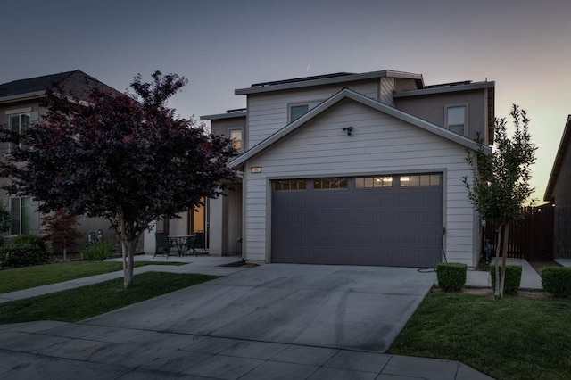 99 N Whittier Ave, Fresno, CA 93727 - view of front facade with concrete driveway, a garage, and a front yard