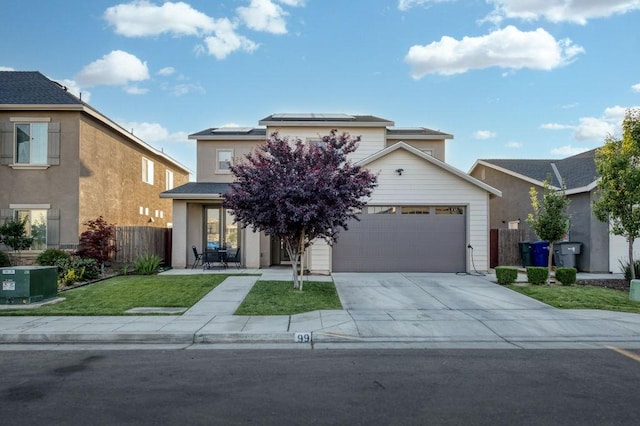99 N Whittier Ave, Fresno, CA 93727 - view of front of home with solar panels, a garage, and driveway