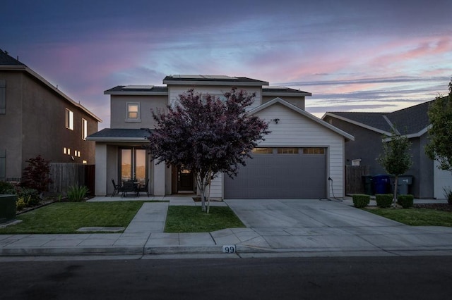 99 N Whittier Ave, Fresno, CA 93727 - view of front of home with solar panels, driveway, and an attached garage
