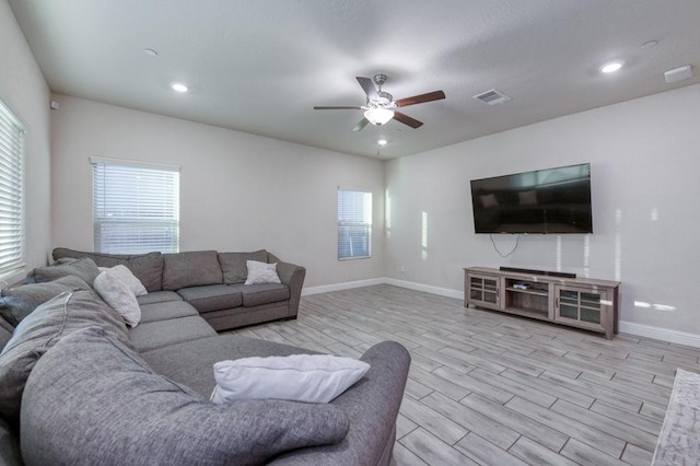 99 N Whittier Ave, Fresno, CA 93727 - living room featuring a ceiling fan, wood tiled floors, baseboards, and recessed lighting
