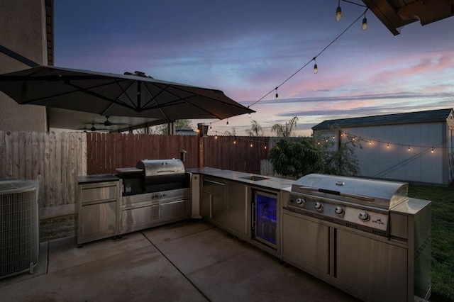99 N Whittier Ave, Fresno, CA 93727 - view of patio featuring area for grilling, fence, and cooling unit