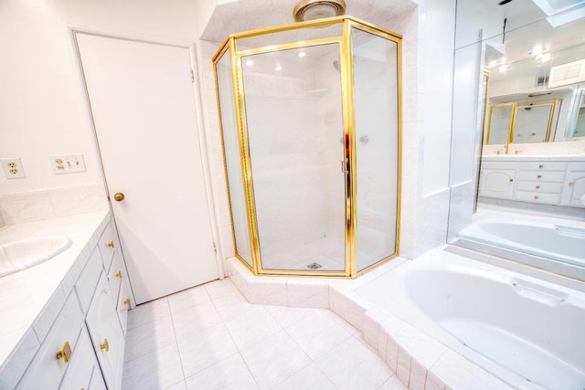 643 Park Ln, Madera, CA 93637 - bathroom with vanity, a stall shower, a garden tub, and tile patterned flooring