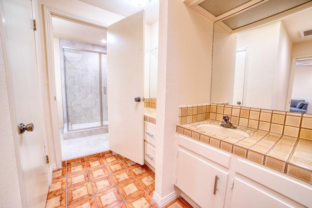 643 Park Ln, Madera, CA 93637 - full bath with a stall shower, vanity, and tasteful backsplash