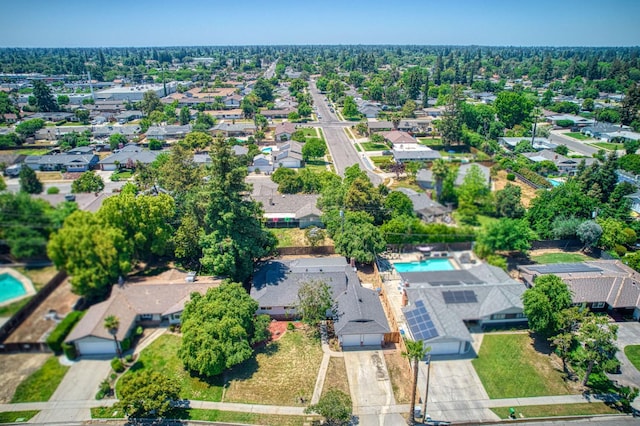 6117 N Colonial Ave, Fresno, CA 93704 - aerial view of property and surrounding area with a pool area and nearby suburban area