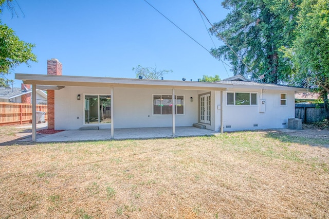 6117 N Colonial Ave, Fresno, CA 93704 - back of house featuring a chimney, crawl space, a patio area, and central AC