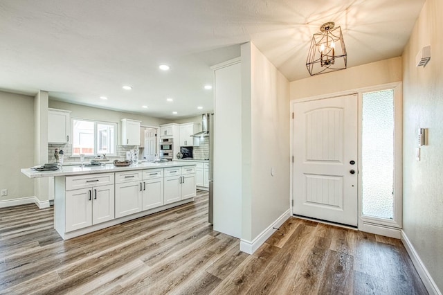 6117 N Colonial Ave, Fresno, CA 93704 - foyer entrance featuring light wood-style flooring, baseboards, a chandelier, and recessed lighting
