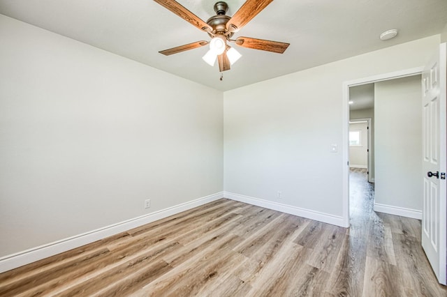 6117 N Colonial Ave, Fresno, CA 93704 - spare room with ceiling fan, light wood-type flooring, and baseboards