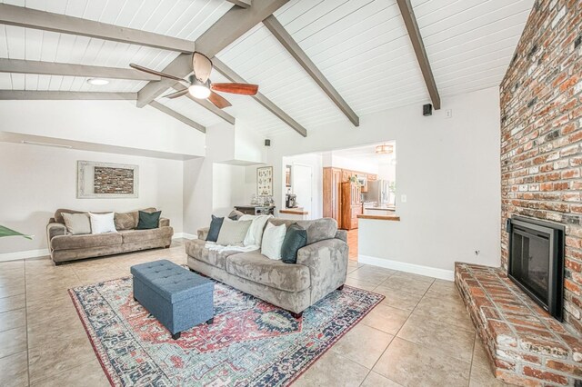 1487 W Paul Ave, Fresno, CA 93711 - living area featuring light tile patterned floors, a ceiling fan, baseboards, and a brick fireplace