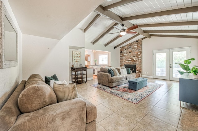 1487 W Paul Ave, Fresno, CA 93711 - living area with light tile patterned floors, ceiling fan, french doors, a fireplace, and baseboards