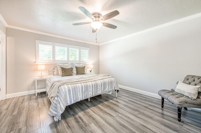 1487 W Paul Ave, Fresno, CA 93711 - bedroom featuring wood finished floors, ceiling fan, and crown molding