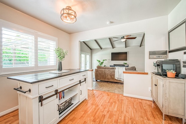 1487 W Paul Ave, Fresno, CA 93711 - kitchen featuring a ceiling fan, white cabinetry, light wood-style floors, baseboards, and wooden ceiling