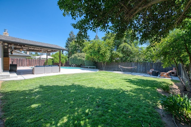 1487 W Paul Ave, Fresno, CA 93711 - fenced backyard with a patio