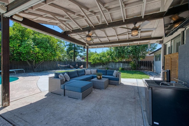 1487 W Paul Ave, Fresno, CA 93711 - fenced backyard featuring a ceiling fan, an outdoor hangout area, and a patio area