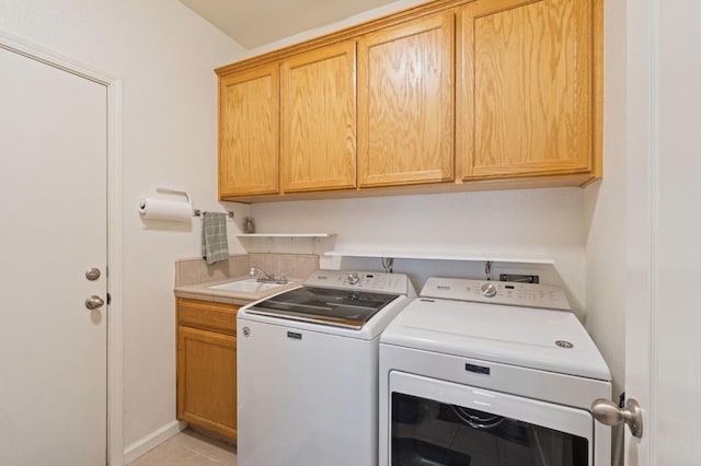 6423 N Bain Ave, Fresno, CA 93722 - laundry room with cabinet space, independent washer and dryer, and light tile patterned floors