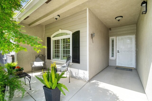 6423 N Bain Ave, Fresno, CA 93722 - property entrance with stucco siding