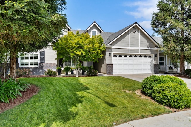 6423 N Bain Ave, Fresno, CA 93722 - view of front facade featuring brick siding, an attached garage, concrete driveway, and a front lawn
