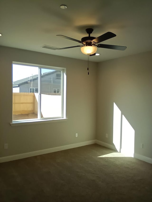 820 Shasta St, Madera, CA 93638 - carpeted spare room featuring ceiling fan and baseboards
