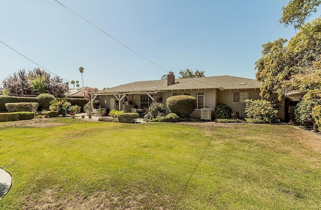 5082 N Maroa Ave, Fresno, CA 93704 - view of front of property with a front yard, a chimney, and a patio
