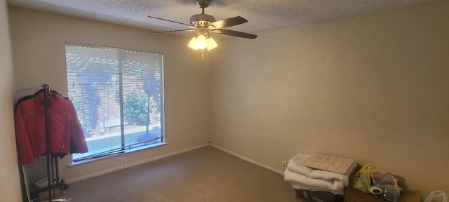 6300 N Palm Ave Unit 108, Fresno, CA 93710 - carpeted empty room with a textured ceiling, ceiling fan, and baseboards