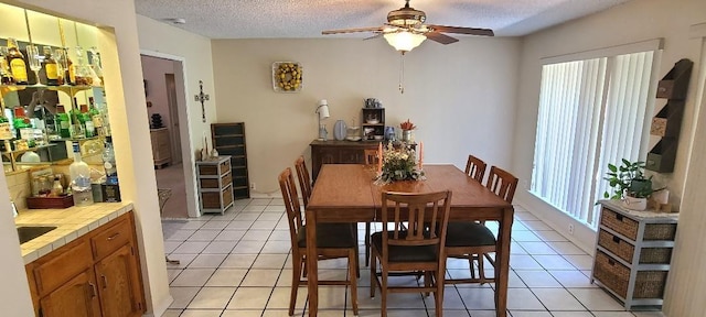 6300 N Palm Ave Unit 108, Fresno, CA 93710 - dining room with a ceiling fan, light tile patterned floors, and a textured ceiling