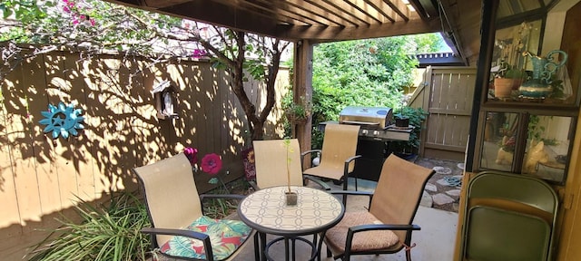 6300 N Palm Ave Unit 108, Fresno, CA 93710 - view of patio / terrace with fence, grilling area, and outdoor dining space