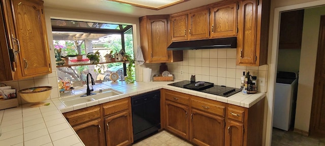 6300 N Palm Ave Unit 108, Fresno, CA 93710 - kitchen featuring a sink, under cabinet range hood, black appliances, tasteful backsplash, and tile counters