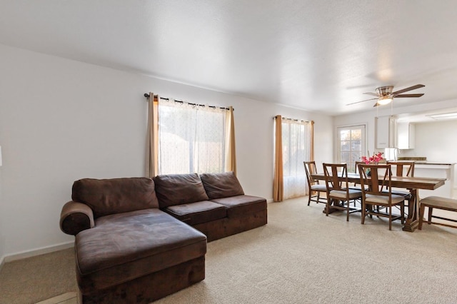 977 E Pennsylvania Ave, Fresno, CA 93720 - living room with light carpet and a ceiling fan