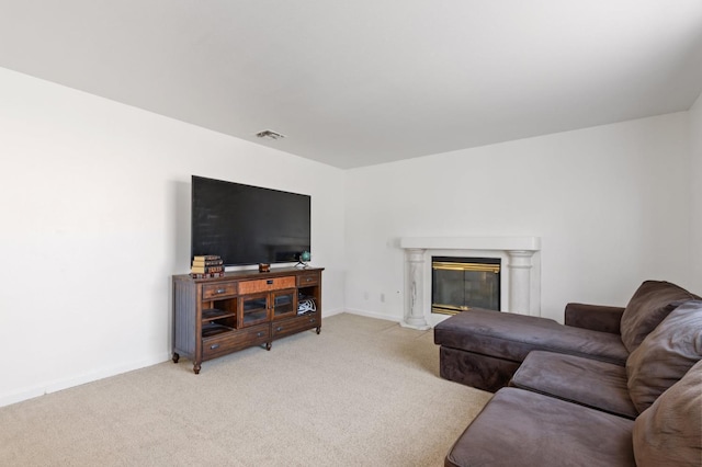 977 E Pennsylvania Ave, Fresno, CA 93720 - living area featuring light colored carpet, baseboards, and a premium fireplace