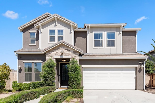 11289 N Alicante Dr, Fresno, CA 93730 - view of front of property with fence, an attached garage, concrete driveway, and board and batten siding