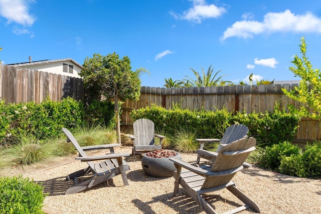 11289 N Alicante Dr, Fresno, CA 93730 - view of patio with an outdoor fire pit and a fenced backyard